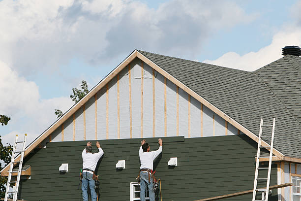 Professional Siding technician working in Asheville, NC